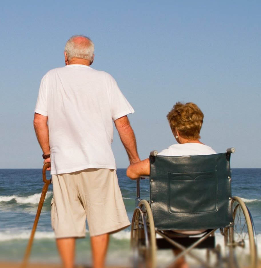senior-couple-on-beach-the-wife-is-disabled-and-sitting-on-wheelchair